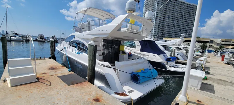 Slide: The Image of Azimut 45 Flybridge 2013 yacht docked at marina on a sunny day. - 2