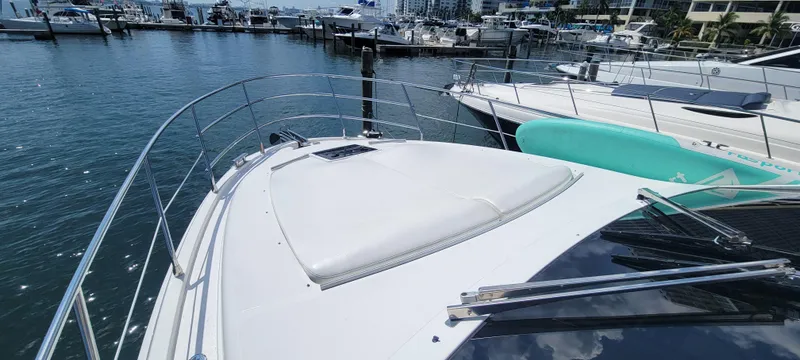Slide: The Image of 2013 Azimut 45 Flybridge yacht docked at a marina. - 20