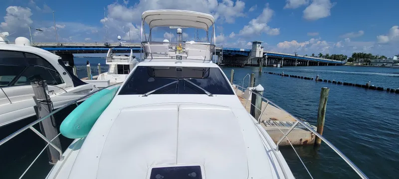Slide: The Image of 2013 Azimut 45 Flybridge yacht docked at marina with blue sky. - 22