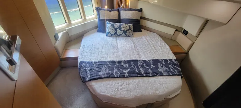 Slide: The Image of Luxurious bedroom in a 2013 Azimut 45 Flybridge yacht with elegant bedding. - 29