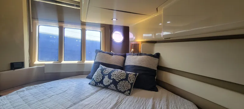 Slide: The Image of Luxurious bedroom interior of 2013 Azimut 45 Flybridge yacht with large windows. - 30