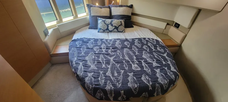 Slide: The Image of Luxurious bedroom in 2013 Azimut 45 Flybridge yacht with nautical-themed bedding. - 32