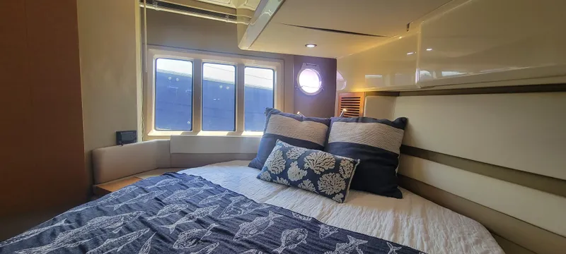 Slide: The Image of Luxurious bedroom interior of 2013 Azimut 45 Flybridge yacht with cozy bedding. - 33