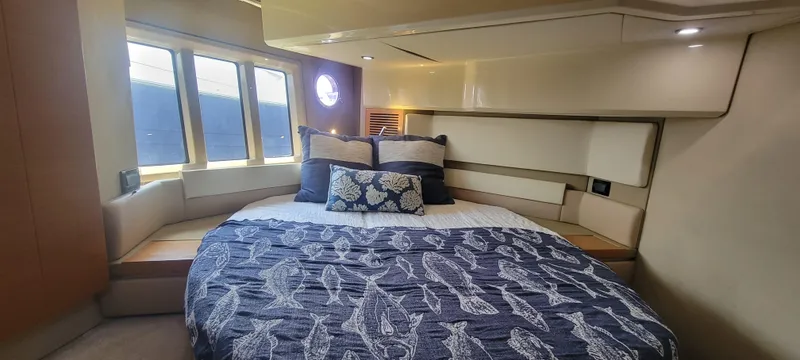 Slide: The Image of Luxurious bedroom interior of 2013 Azimut 45 Flybridge yacht with large bed and windows. - 35