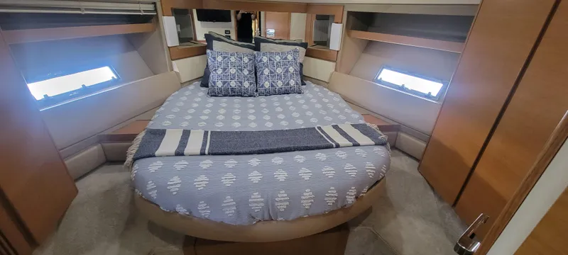 Slide: The Image of Luxurious bedroom in 2013 Azimut 45 Flybridge yacht with cozy bed and stylish decor. - 37