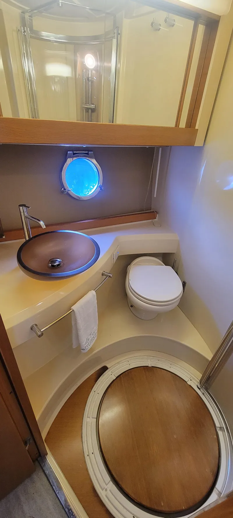 Slide: The Image of 2013 Azimut 45 Flybridge yacht bathroom with modern fixtures and porthole window. - 43