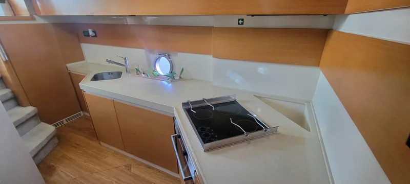 Slide: The Image of Modern kitchen area in 2013 Azimut 45 Flybridge yacht with stove and sink. - 46