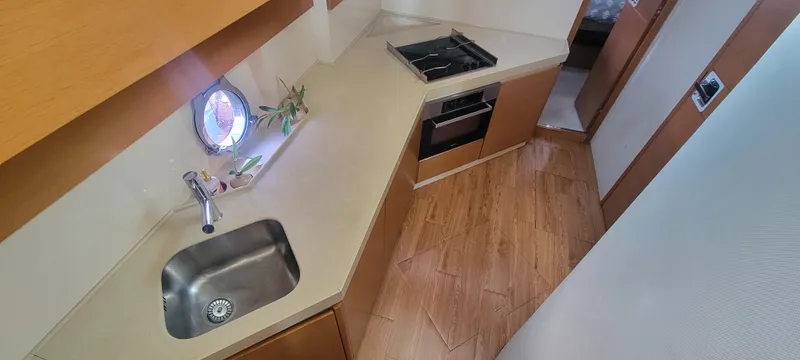 Slide: The Image of Modern kitchen area in 2013 Azimut 45 Flybridge yacht with sink and stove. - 47