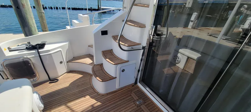 Slide: The Image of 2013 Azimut 45 Flybridge yacht with teak deck and spiral staircase. - 7