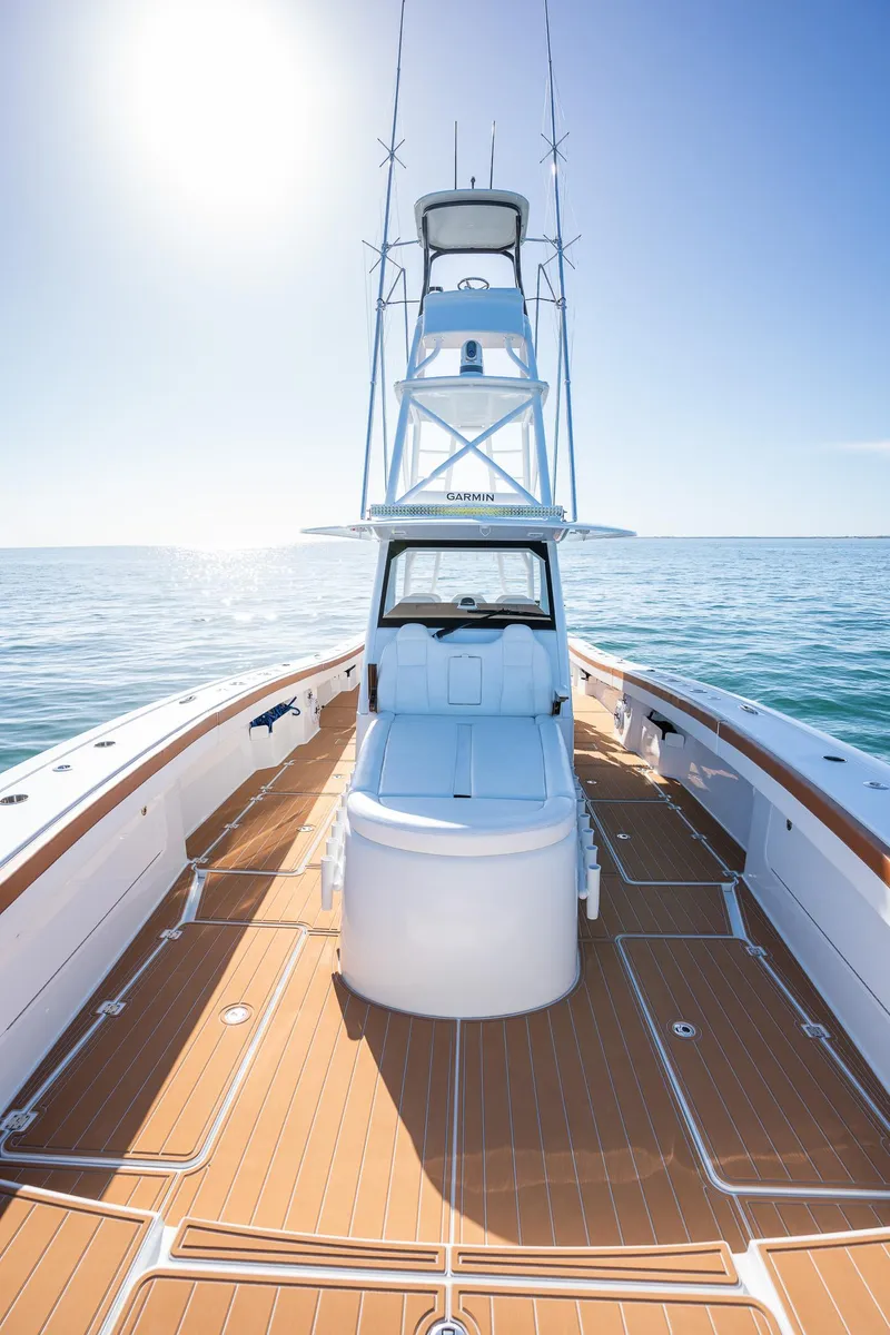 Slide: The Image of 2022 Freeman 47 boat on open water, sunny day, clear sky. - 10