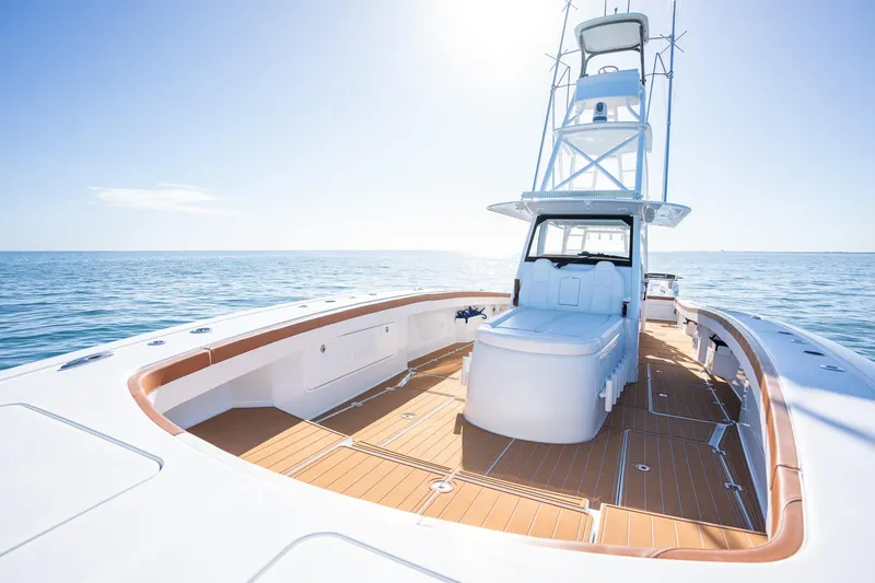 Slide: The Image of Freeman 47 boat 2022 model on open water with clear blue sky. - 12