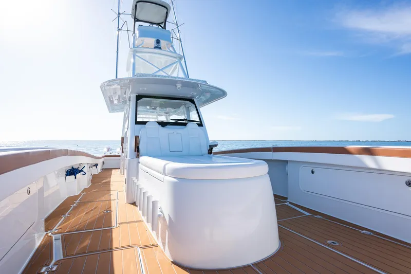 Slide: The Image of Freeman 47 boat 2022 model with spacious deck and modern design on open water. - 13