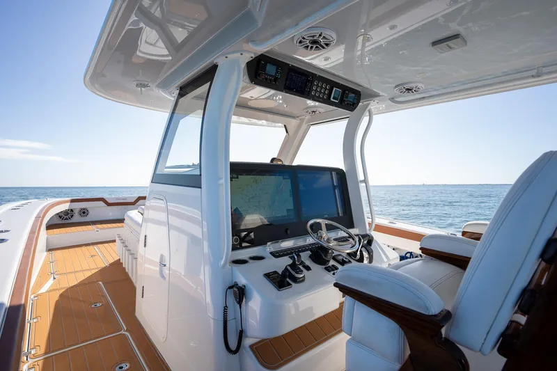 Slide: The Image of Freeman 47 boat interior, 2022 model, with advanced navigation system and luxurious seating. - 15