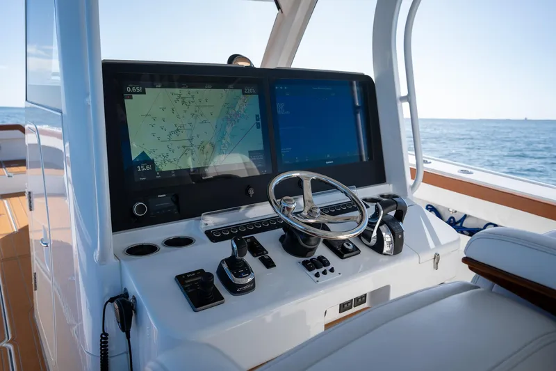 Slide: The Image of Freeman 47 boat helm with navigation screens and controls, 2022 model. - 16