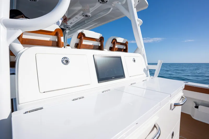 Slide: The Image of Freeman 47 boat console with seating, ocean view, 2022 model. - 22
