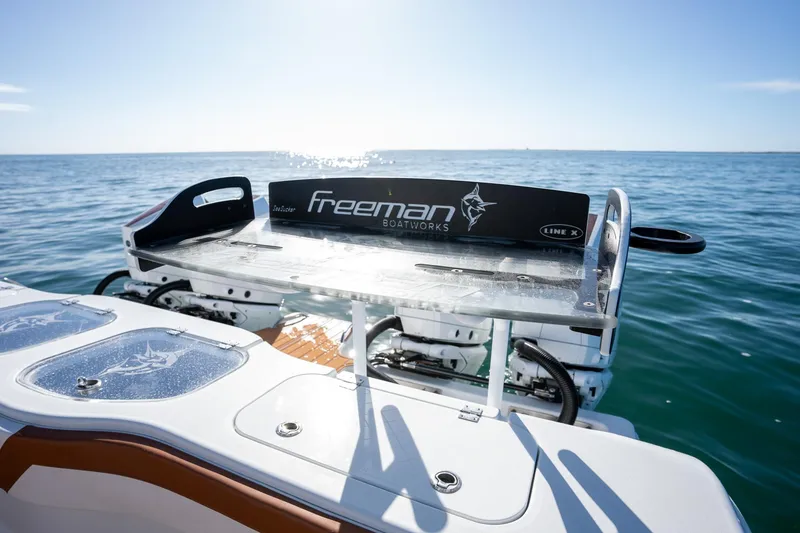 Slide: The Image of Freeman 47 boat, 2022 model, on open water with fishing station. - 23