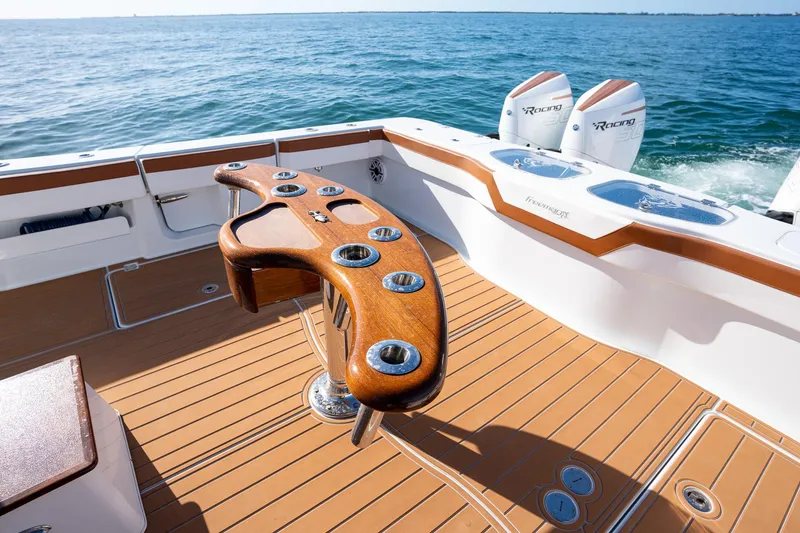 Slide: The Image of Freeman 47 boat 2022 model with teak deck and dual outboard engines. - 24
