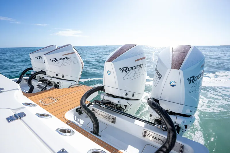 Slide: The Image of Freeman 47 boat with triple Mercury Racing outboard engines, 2022 model, on open water. - 29