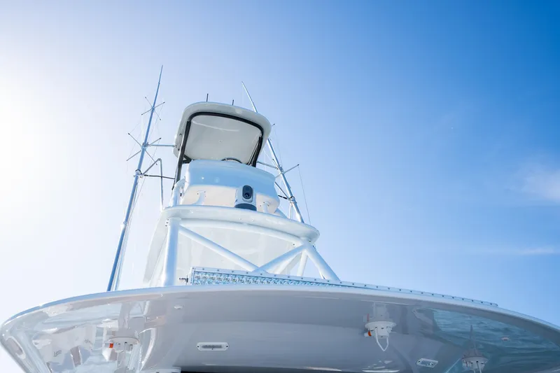 Slide: The Image of Freeman 47 boat, 2022 model, under clear blue sky. - 33