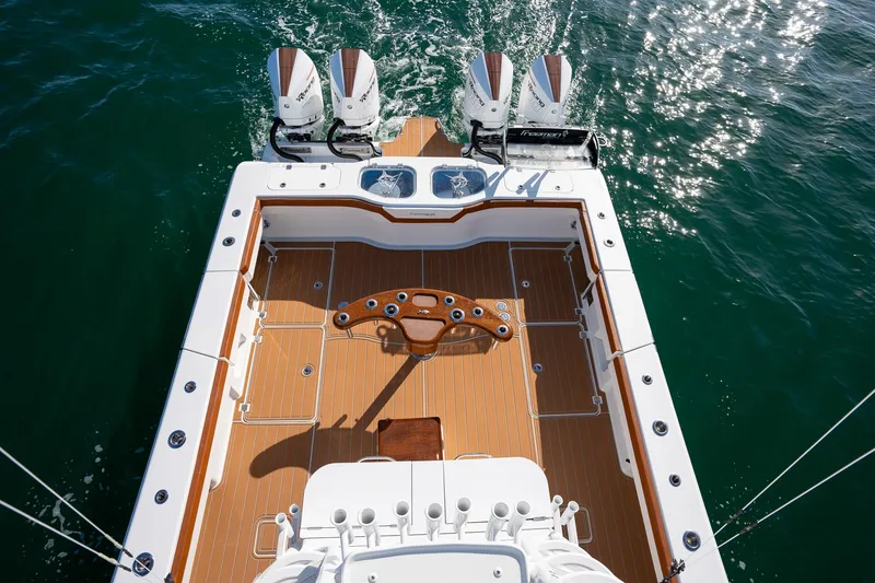 Slide: The Image of Freeman 47 boat 2022 model with quad engines and spacious deck on water. - 36