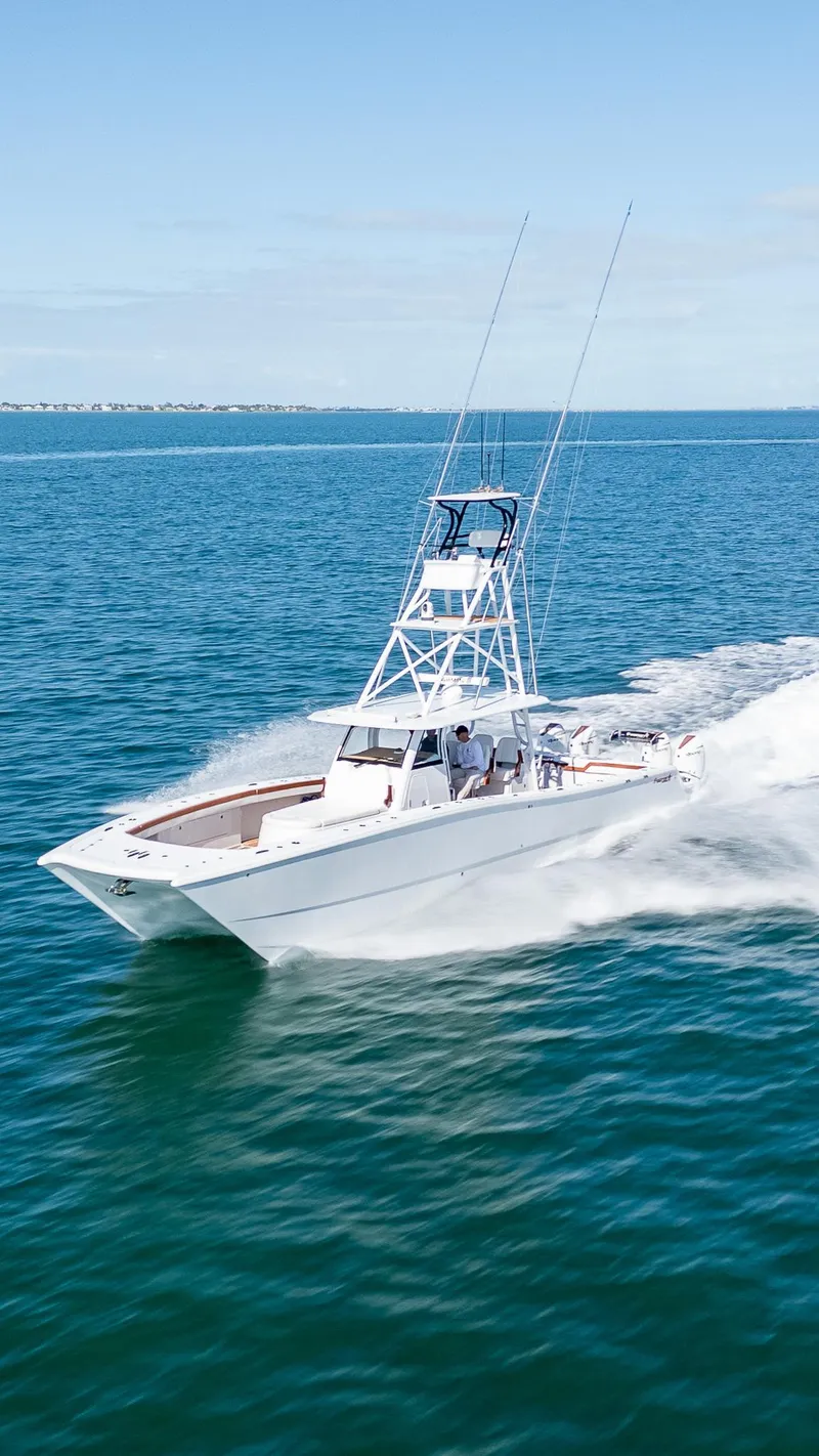 Slide: The Image of 2022 Freeman 47 boat cruising on open water. - 41