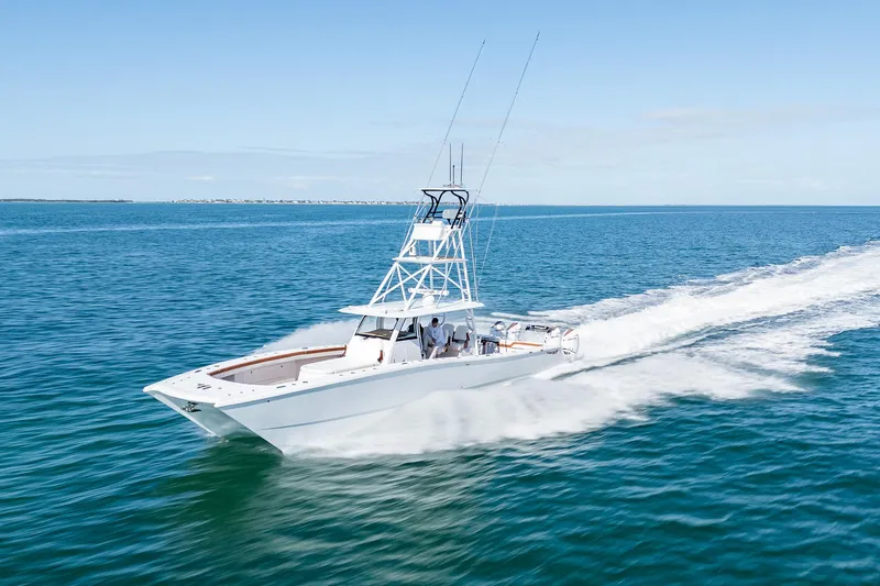 Slide: The Image of 2022 Freeman 47 boat cruising on open water. - 42