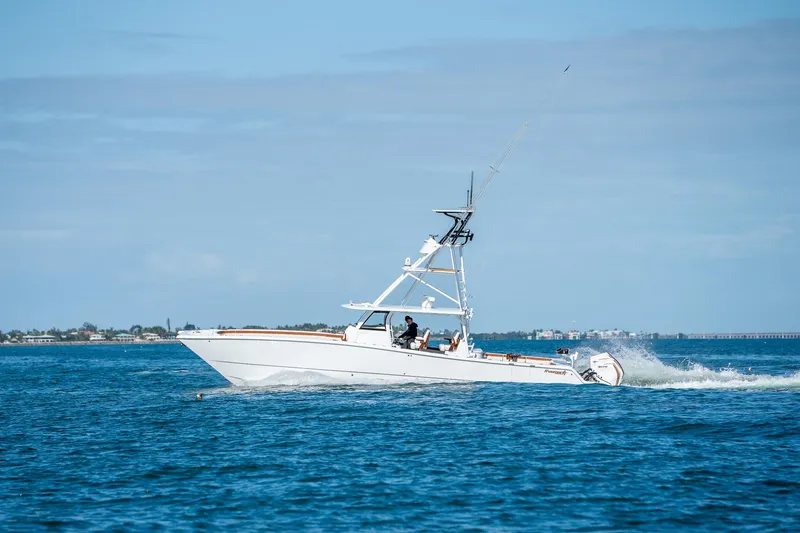 Slide: The Image of 2022 Freeman 47 boat cruising on open water. - 43