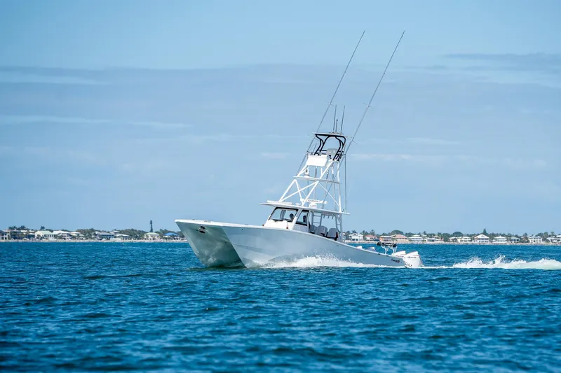 Slide: The Image of 2022 Freeman 47 boat cruising on open water. - 44