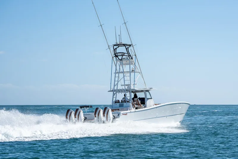 Slide: The Image of 2022 Freeman 47 boat cruising on open water. - 6