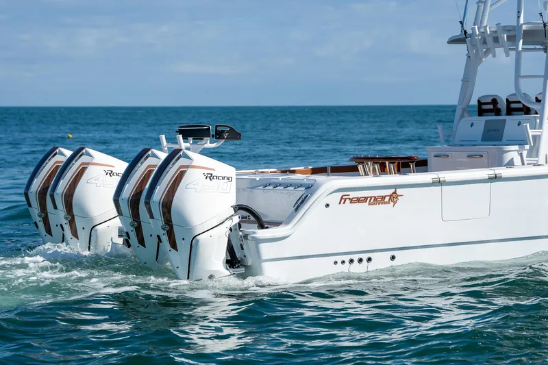 Slide: The Image of Freeman 47 boat 2022 model with quad outboard engines on the ocean. - 7