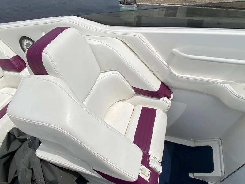 Slide: The Image of 1998 Fountain 35 Lightning boat interior with white and purple seats. - 12