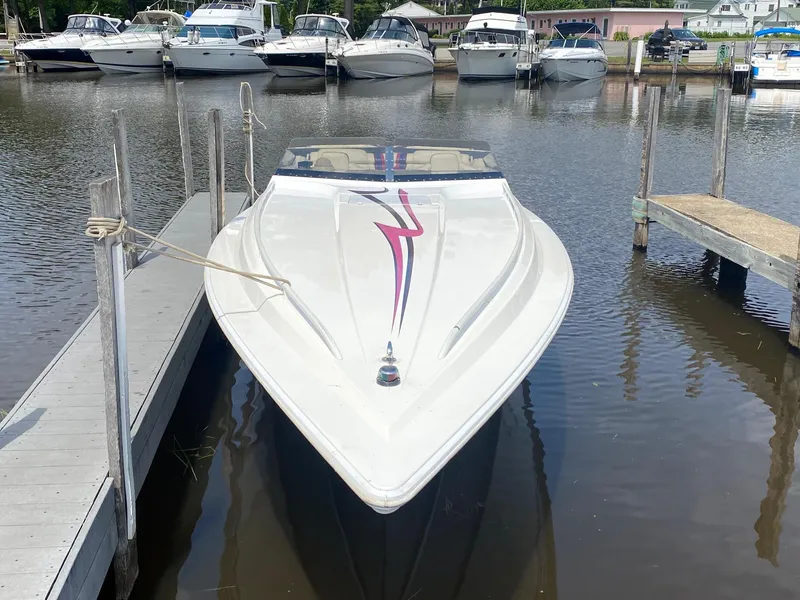 Slide: The Image of 1998 Fountain 35 Lightning speedboat docked at a marina. - 2