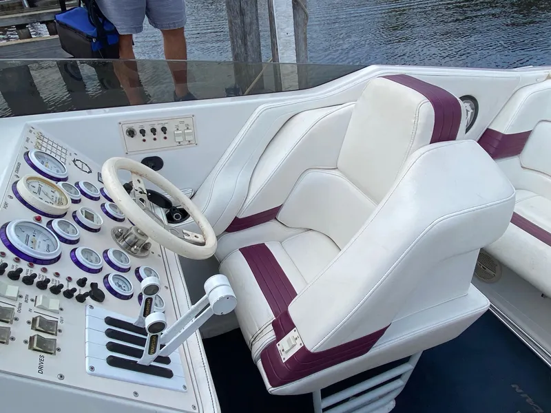 Slide: The Image of 1998 Fountain 35 Lightning boat cockpit with white and purple seats. - 7