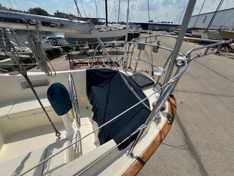 Slide: The Image of 1982 Campion C-320 Pilot House sailboat docked at a marina. - 10