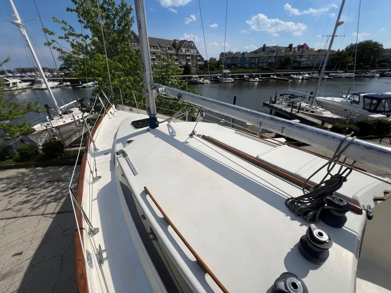 Slide: The Image of 1982 Campion C-320 Pilot House sailboat docked at a marina on a sunny day. - 11