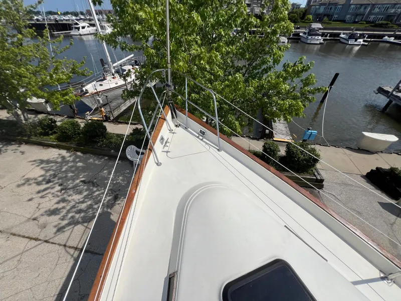 Slide: The Image of 1982 Campion C-320 Pilot House boat docked at a marina, view from the bow. - 12