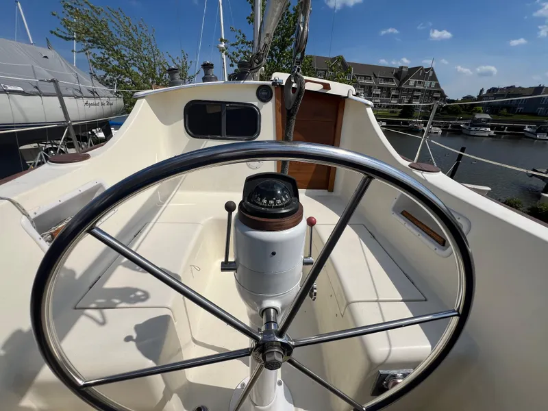 Slide: The Image of 1982 Campion C-320 Pilot House boat cockpit with steering wheel and compass. - 17