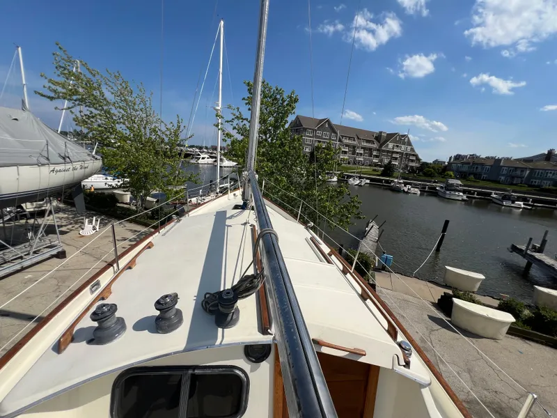 Slide: The Image of 1982 Campion C-320 Pilot House sailboat docked at a marina on a sunny day. - 18