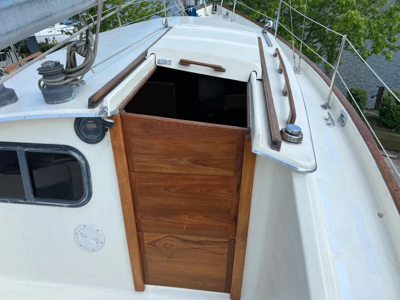 Slide: The Image of 1982 Campion C-320 Pilot House sailboat deck with wooden cabin door. - 22