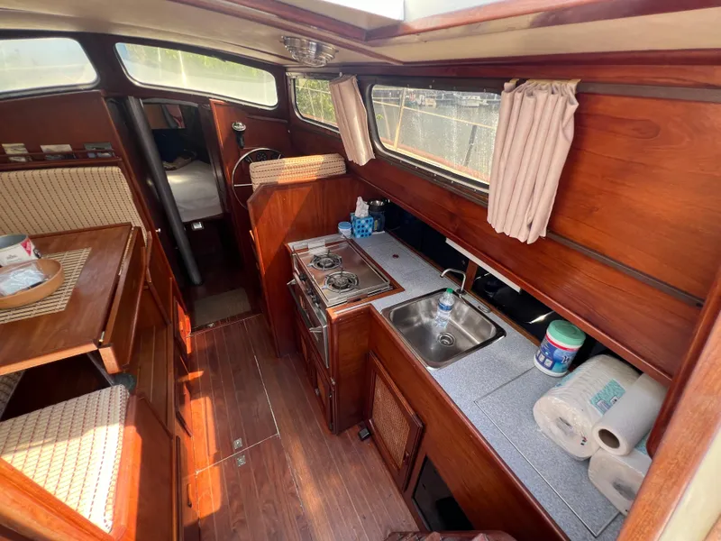 Slide: The Image of Interior of 1982 Campion C-320 Pilot House boat with kitchen and seating area. - 23