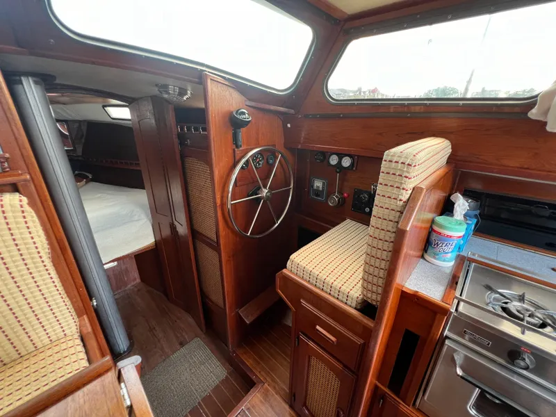 Slide: The Image of Interior of 1982 Campion C-320 Pilot House boat with steering wheel and kitchenette. - 28