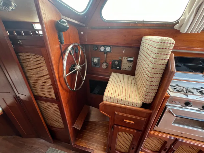 Slide: The Image of 1982 Campion C-320 Pilot House interior with steering wheel and control panel. - 29