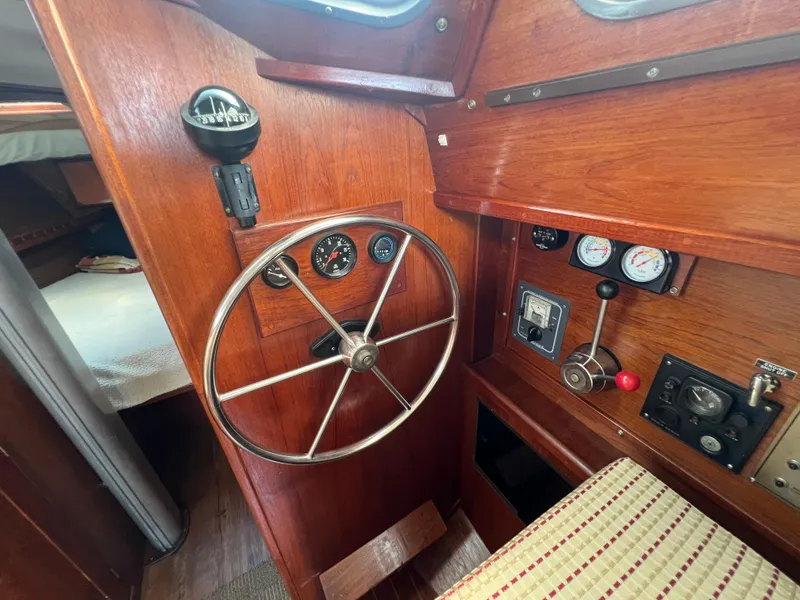 Slide: The Image of 1982 Campion C-320 Pilot House interior with wooden helm and control panel. - 30