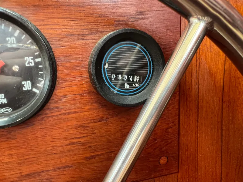 Slide: The Image of Close-up of 1982 Campion C-320 Pilot House boat dashboard with hour meter and tachometer. - 35