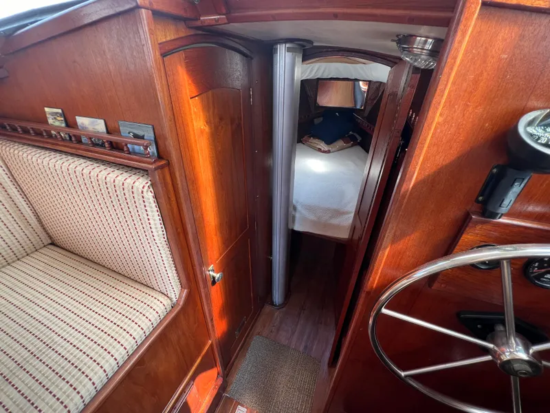 Slide: The Image of Interior of 1982 Campion C-320 Pilot House boat with wooden finish and cozy cabin. - 36