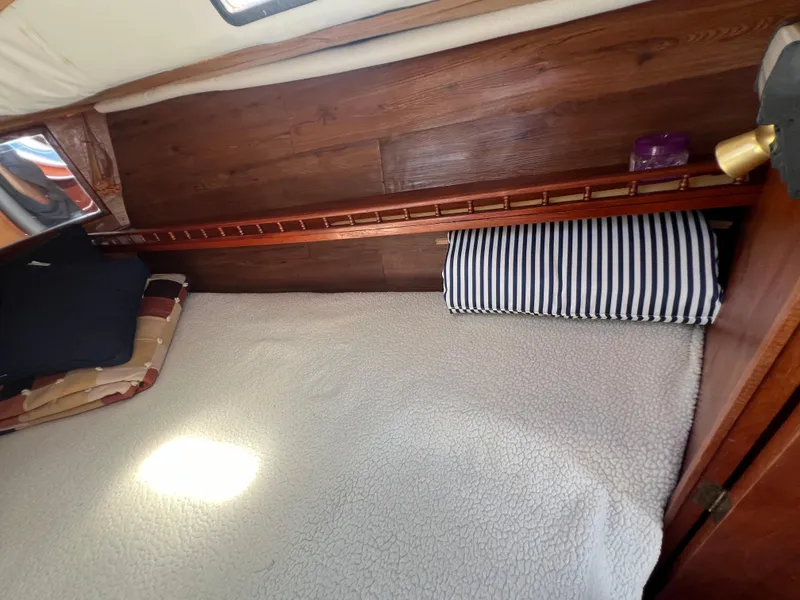 Slide: The Image of Cozy sleeping area in a 1982 Campion C-320 Pilot House boat. - 41