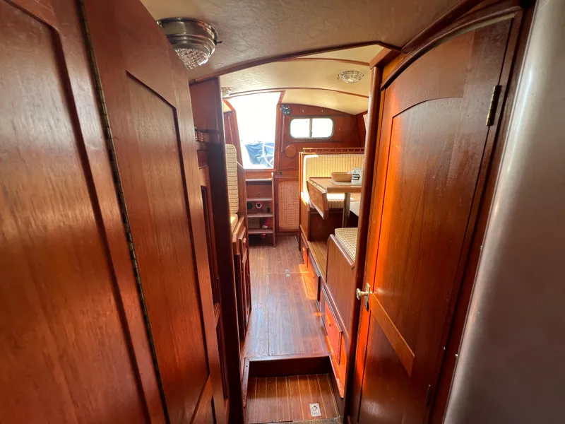 Slide: The Image of 1982 Campion C-320 Pilot House interior with wooden finish and cozy cabin space. - 44