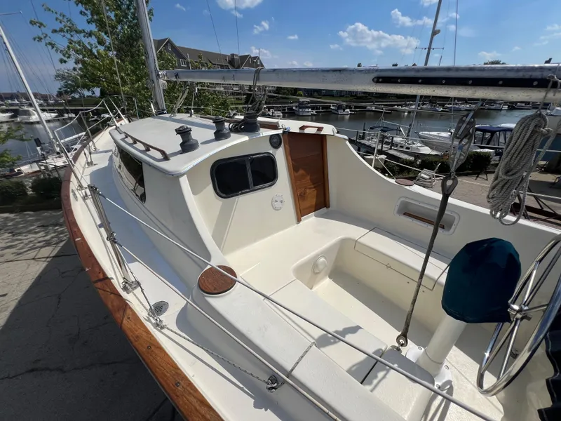 Slide: The Image of 1982 Campion C-320 Pilot House sailboat docked at a marina on a sunny day. - 8