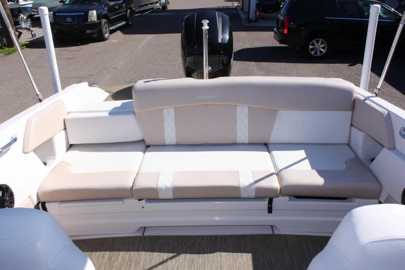 Slide: The Image of 2018 Glastron GT200 boat with beige and white seating. - 10