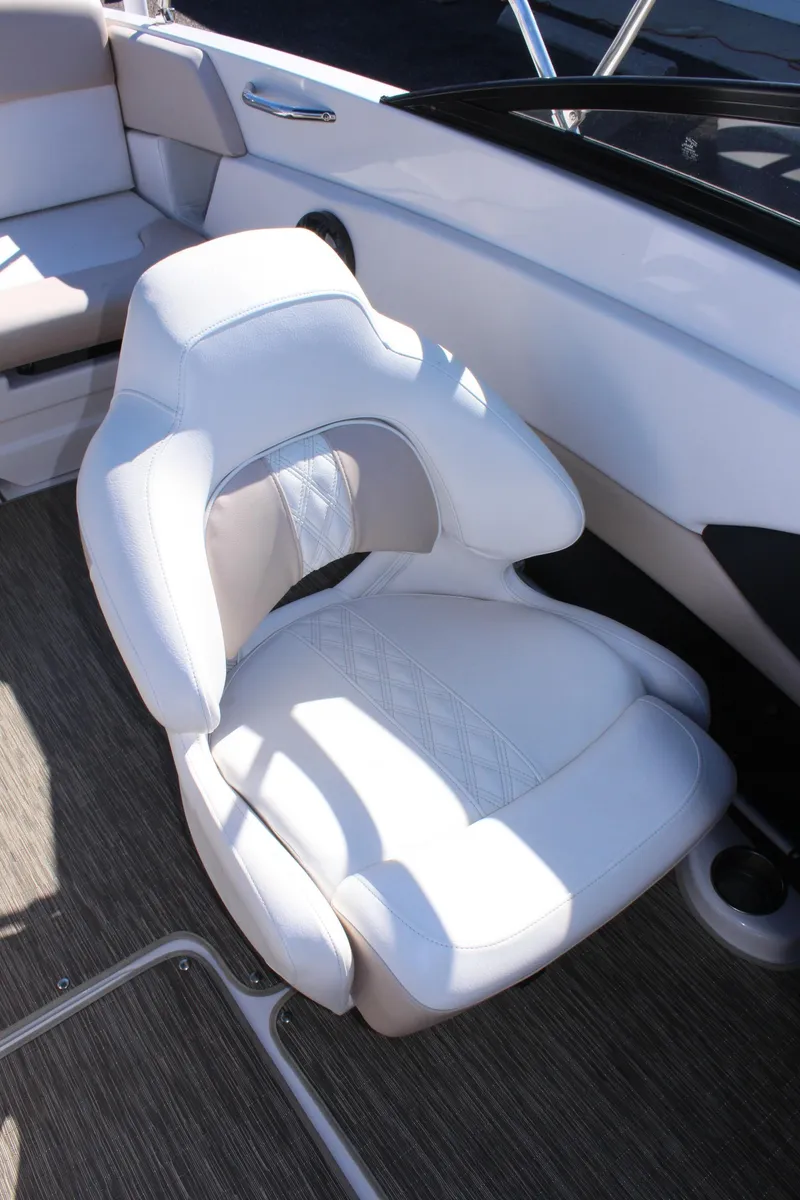 Slide: The Image of 2018 Glastron GT200 boat interior with white captain's chair. - 16